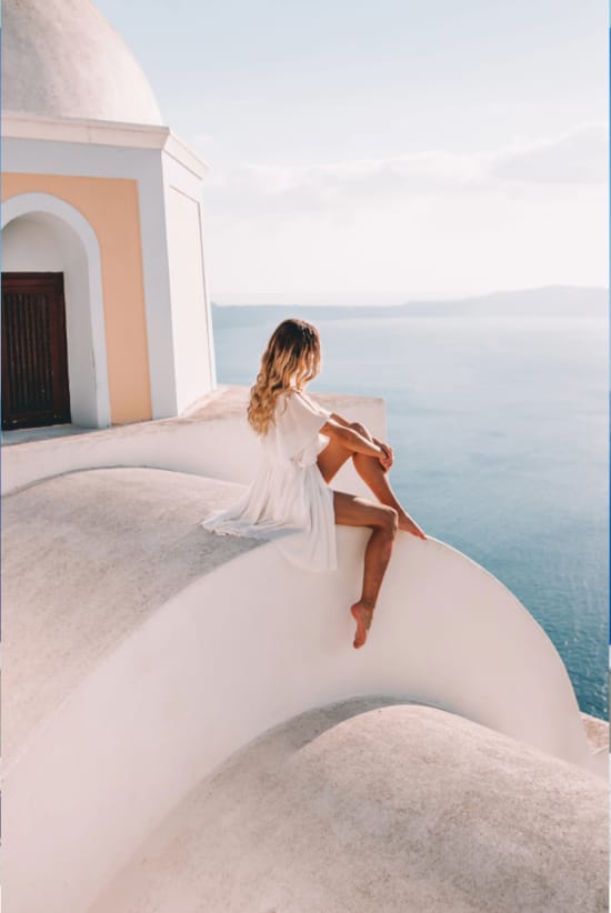 a person sitting on a rock