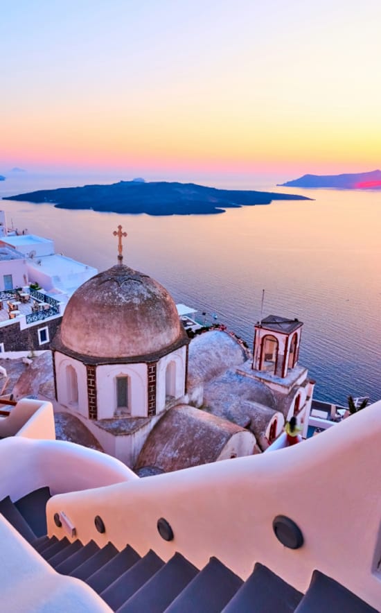 a building with a domed roof by the water