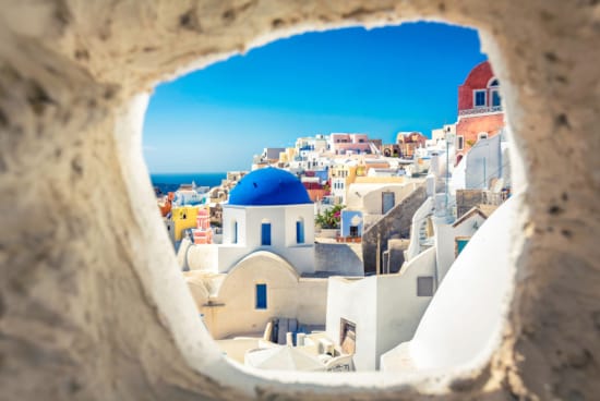 a view of a town from a cliff