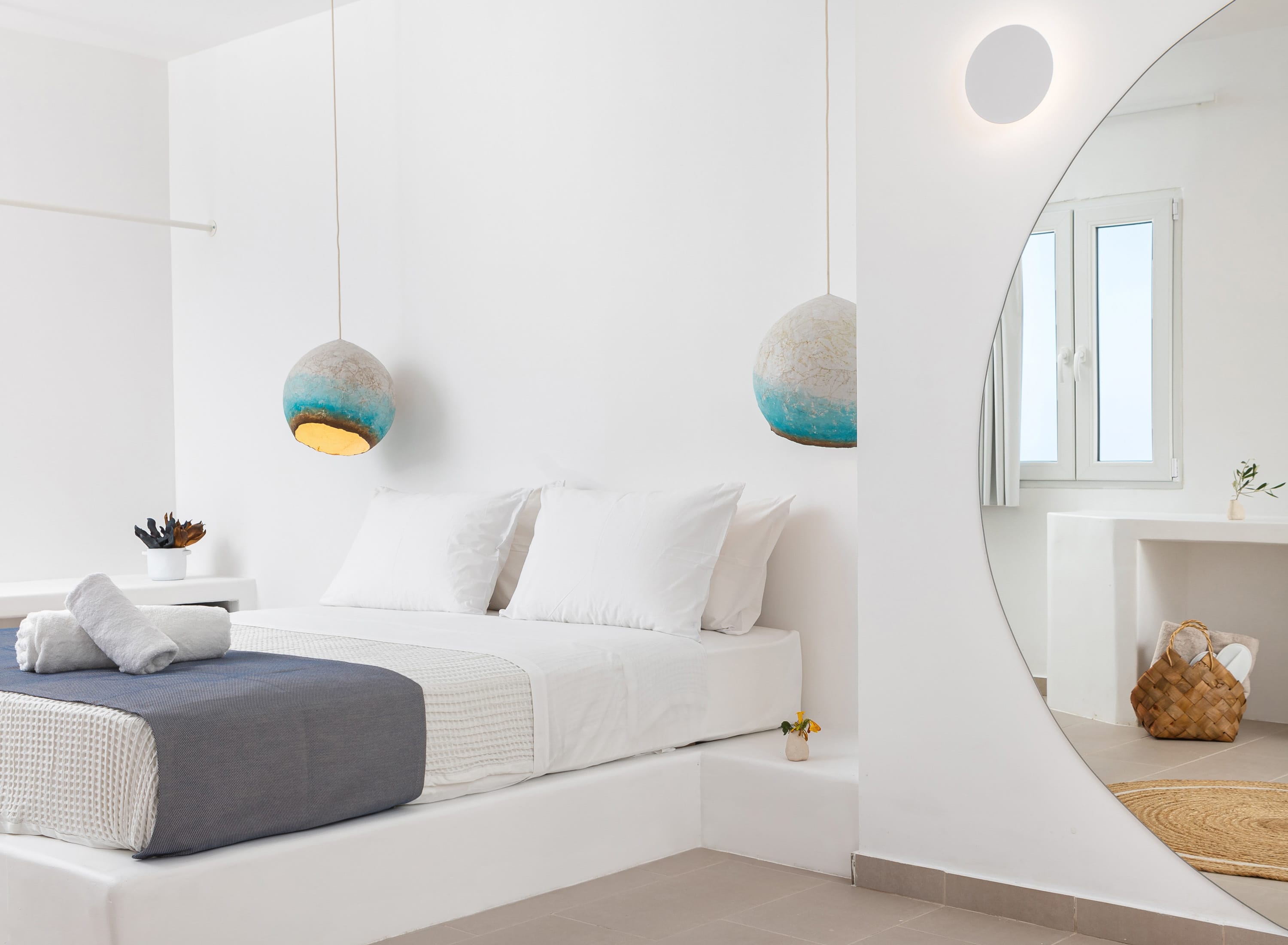 a white couch with a mirror