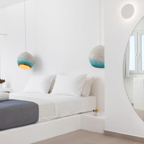 a white couch with a mirror