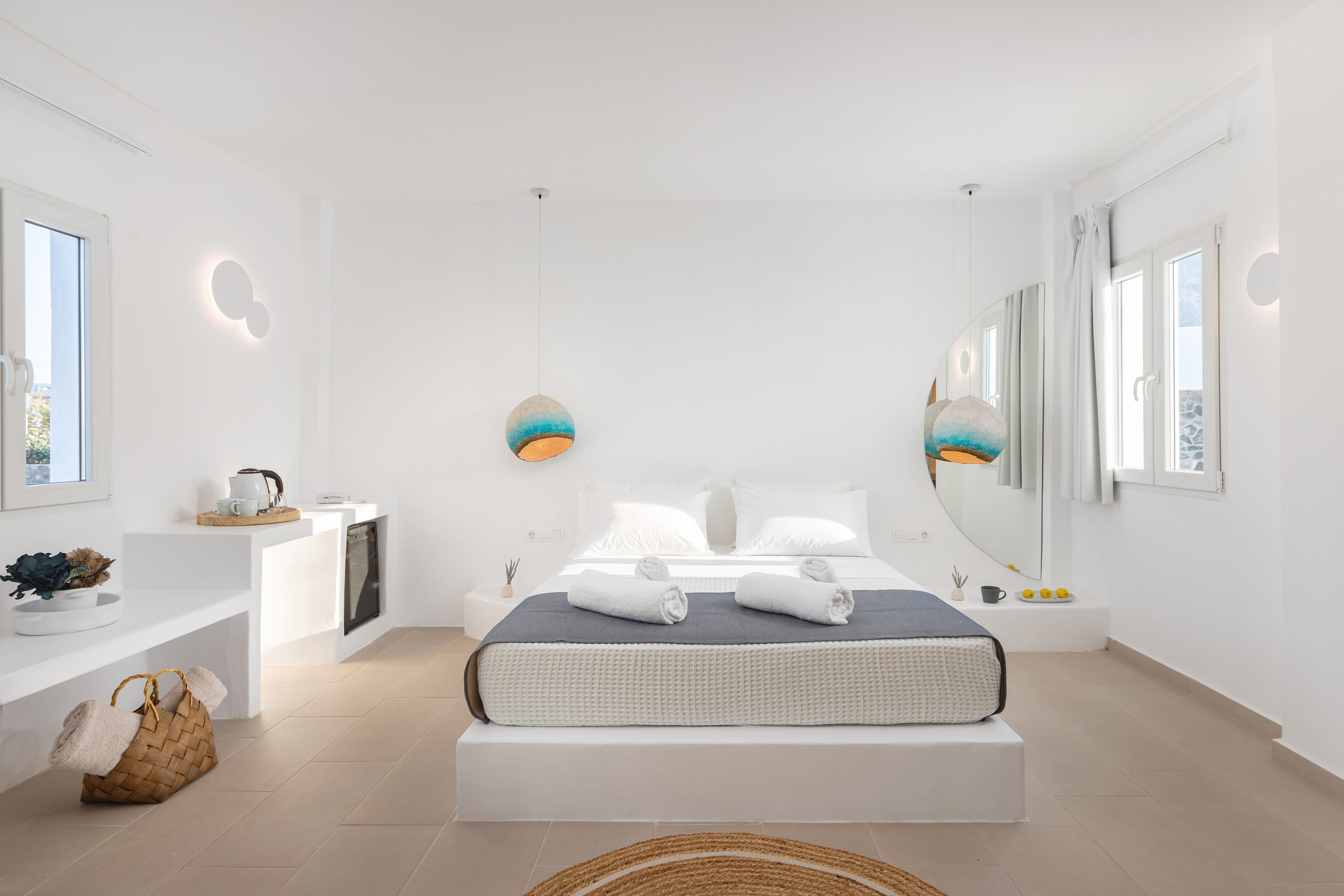 a room with a bed and a mirror