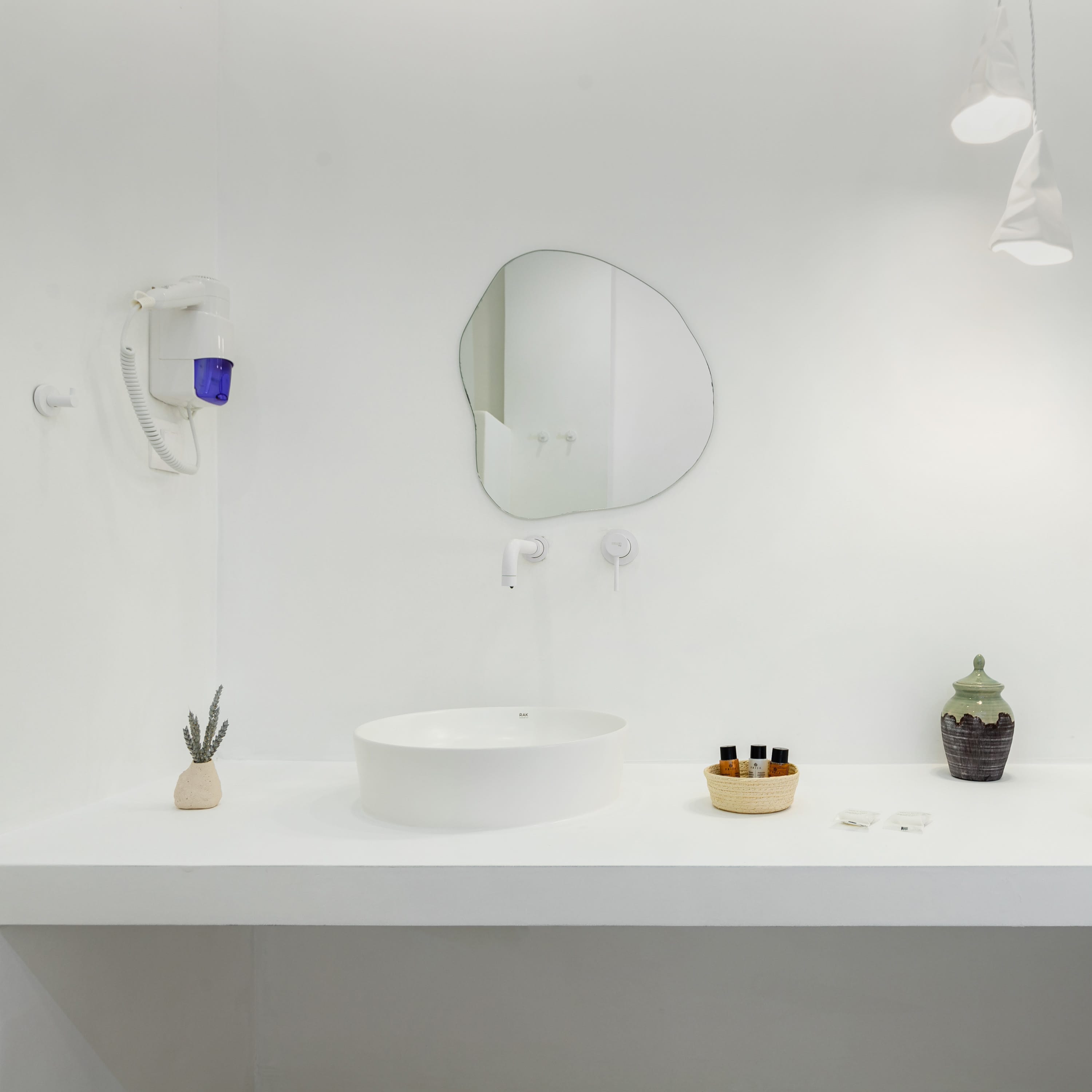 a bathroom with a mirror and sink