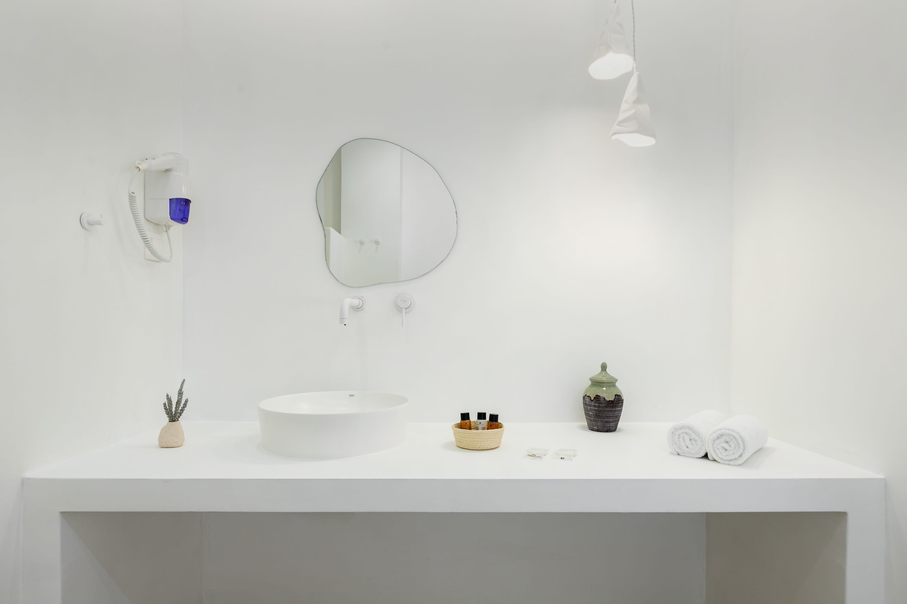 a bathroom with a mirror and sink