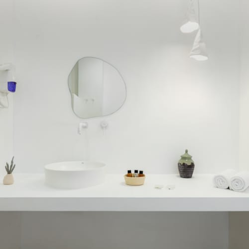 a bathroom with a mirror and sink