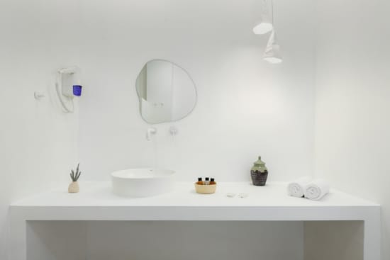 a bathroom with a mirror and sink