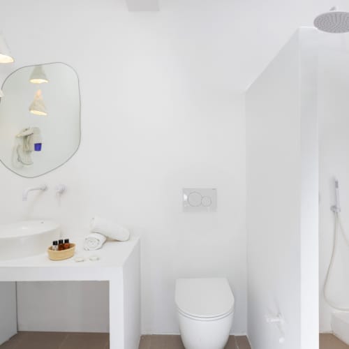 a bathroom with a toilet and sink