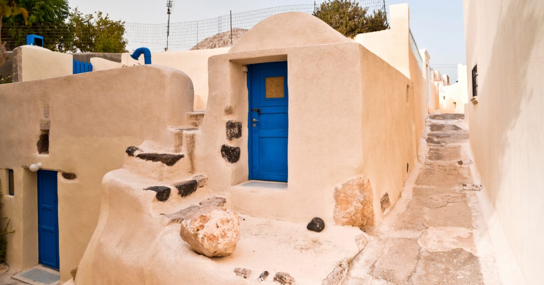 a white building with blue doors