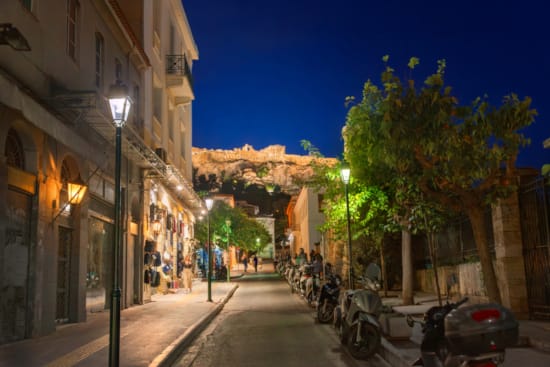 a street with bikes parked on the side
