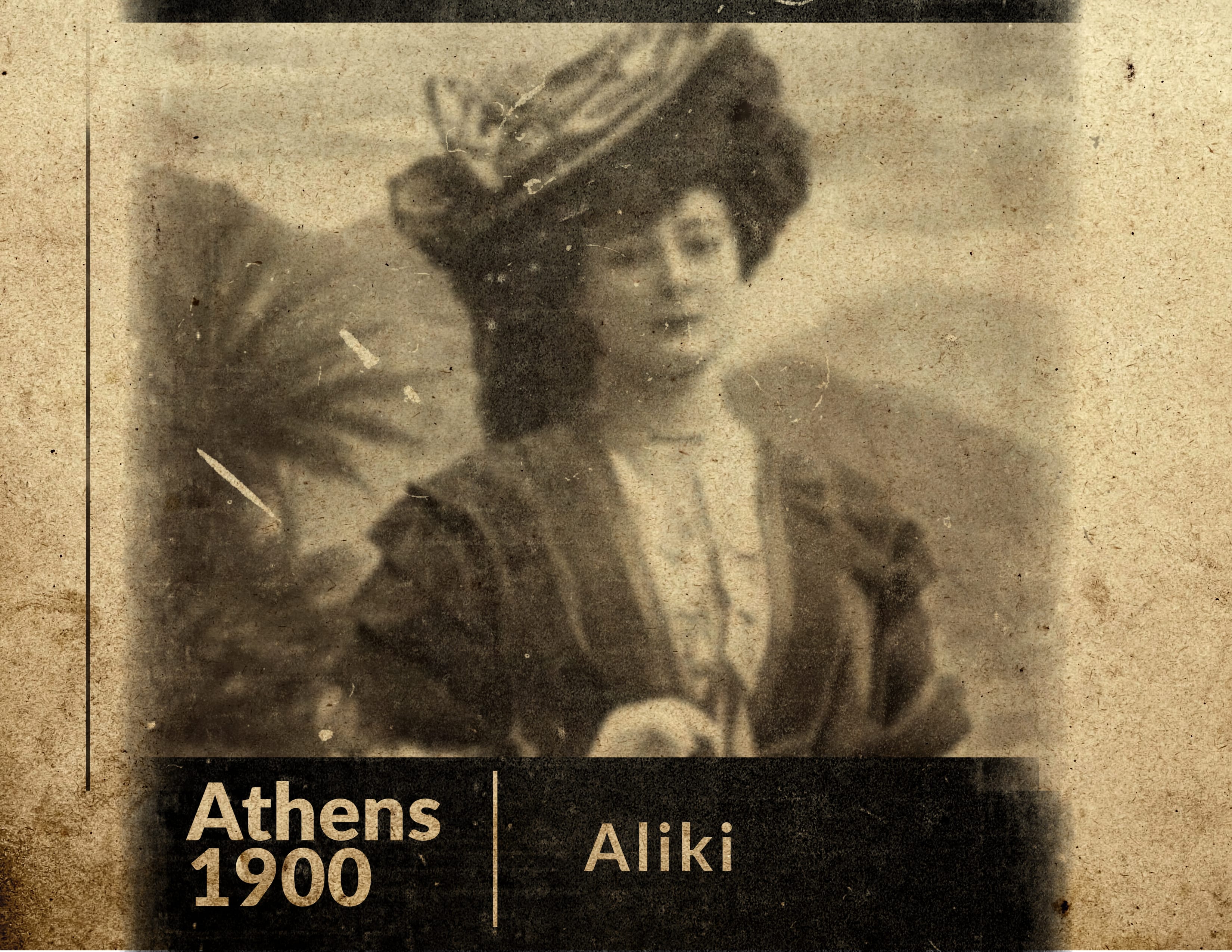 Vintage sepia-toned photograph of Aliki, dated 1900, featured by Kyria Boutique House. Dressed in period attire with a stylish hat and dignified poise, she embodies the historical elegance of Plaka, Athens