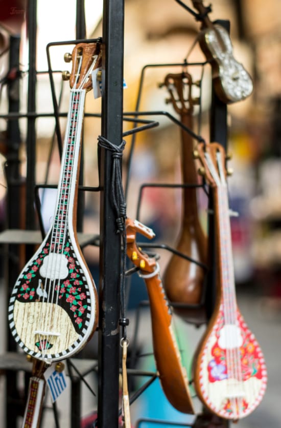 a group of guitars on a rack