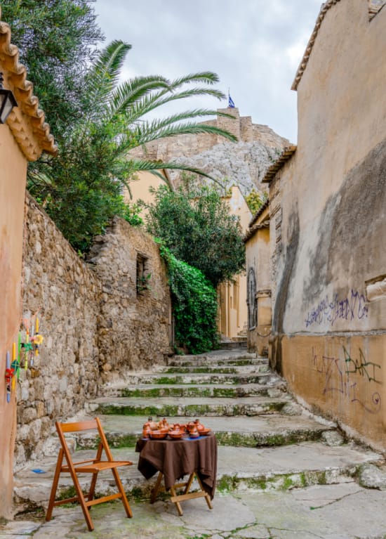 a table and chairs outside a building