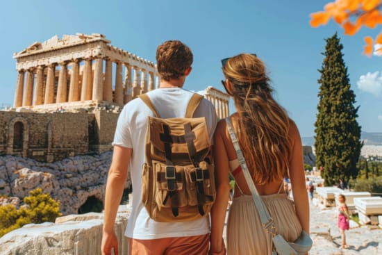 a man and woman walking towards a building