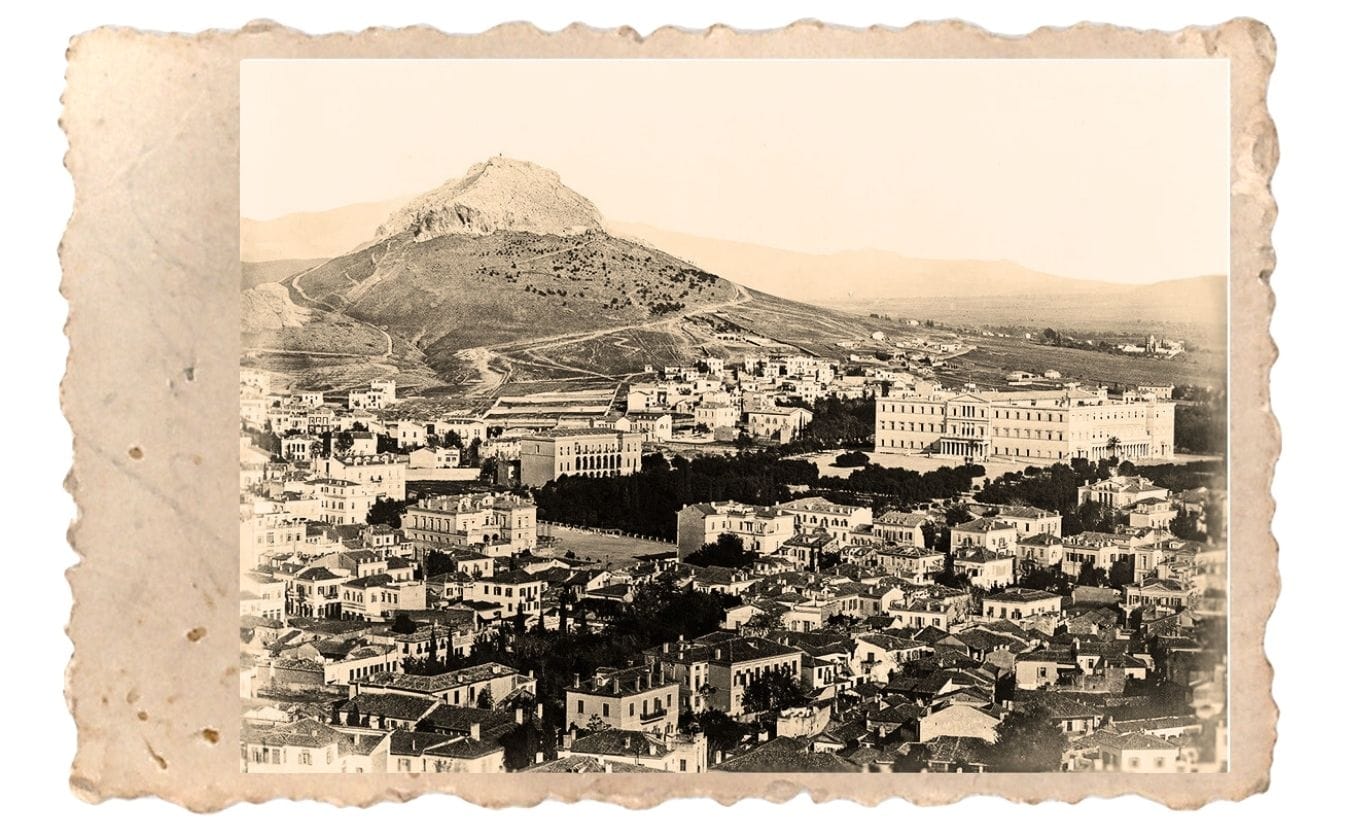 a city with mountains in the background