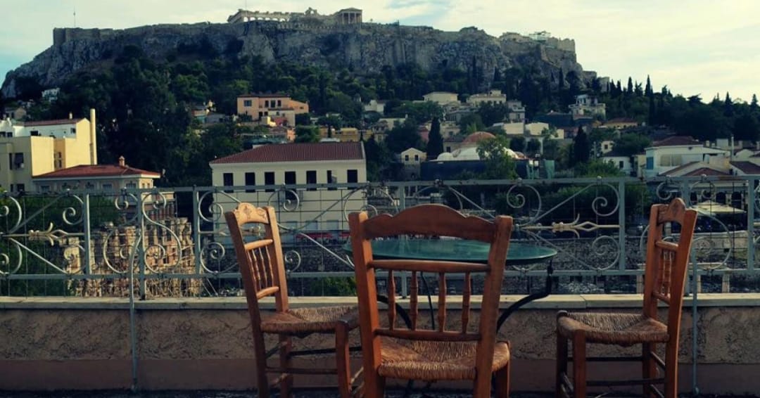 a group of chairs on a balcony
