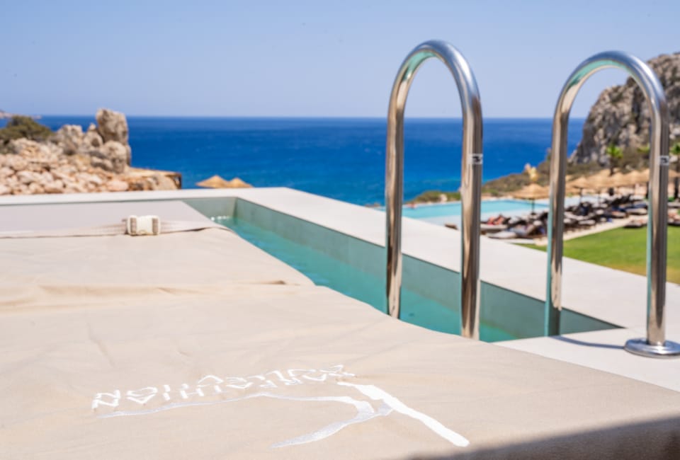 a pool with a metal railing