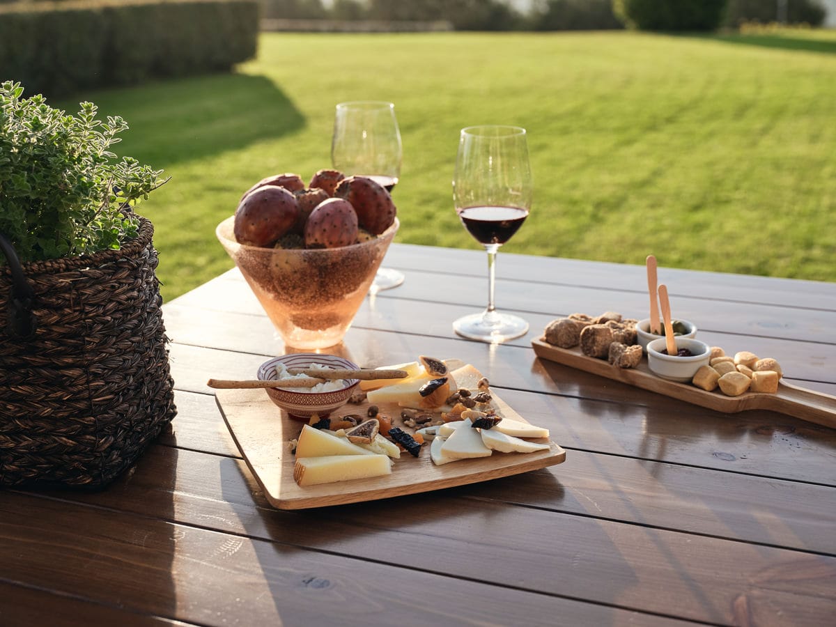a table with food and wine glasses