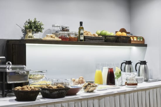 a kitchen counter with food and drinks