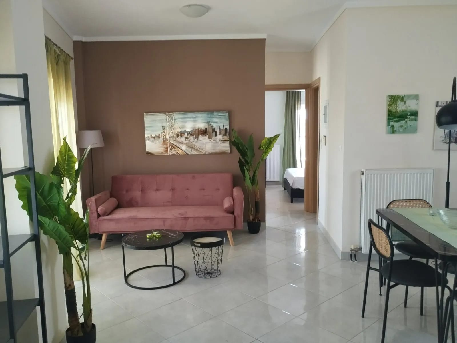 a living room with a pink couch