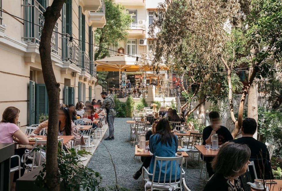 people sitting at tables outside