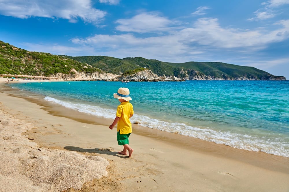 a child walking on a beach
