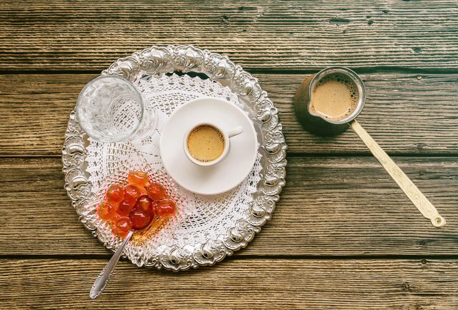 a plate of food and a cup of liquid
