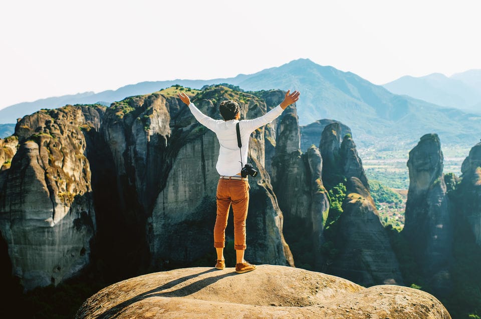 a person standing on a rock