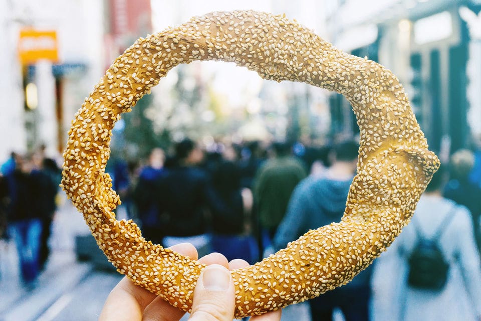 a hand holding a golden object