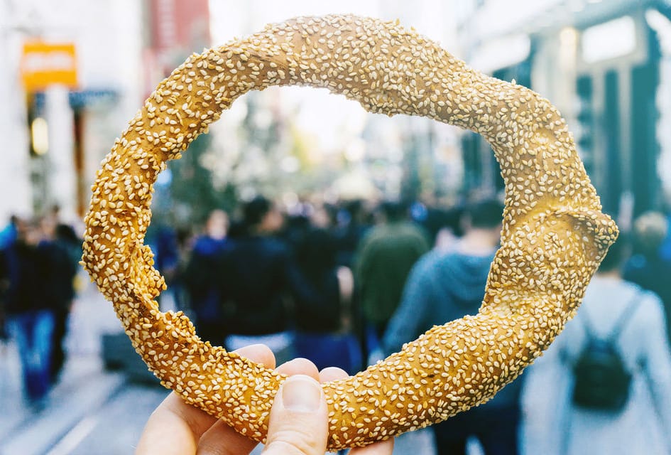 a hand holding a golden object
