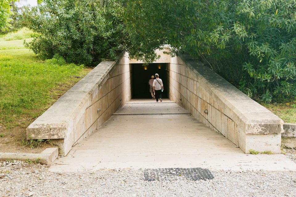 a person walking through a tunnel