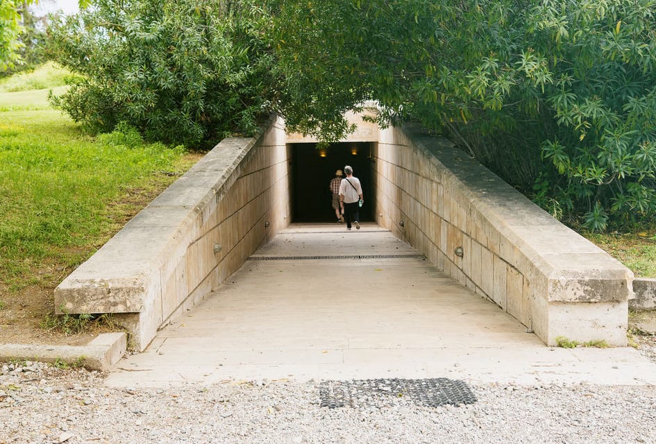 a person walking through a tunnel