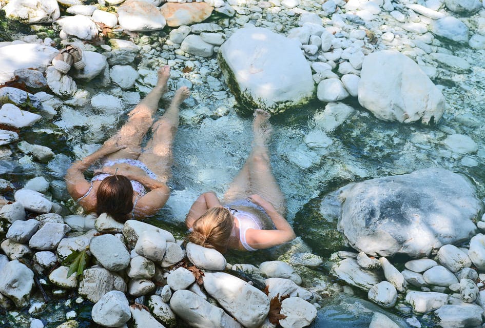 a group of people in a river