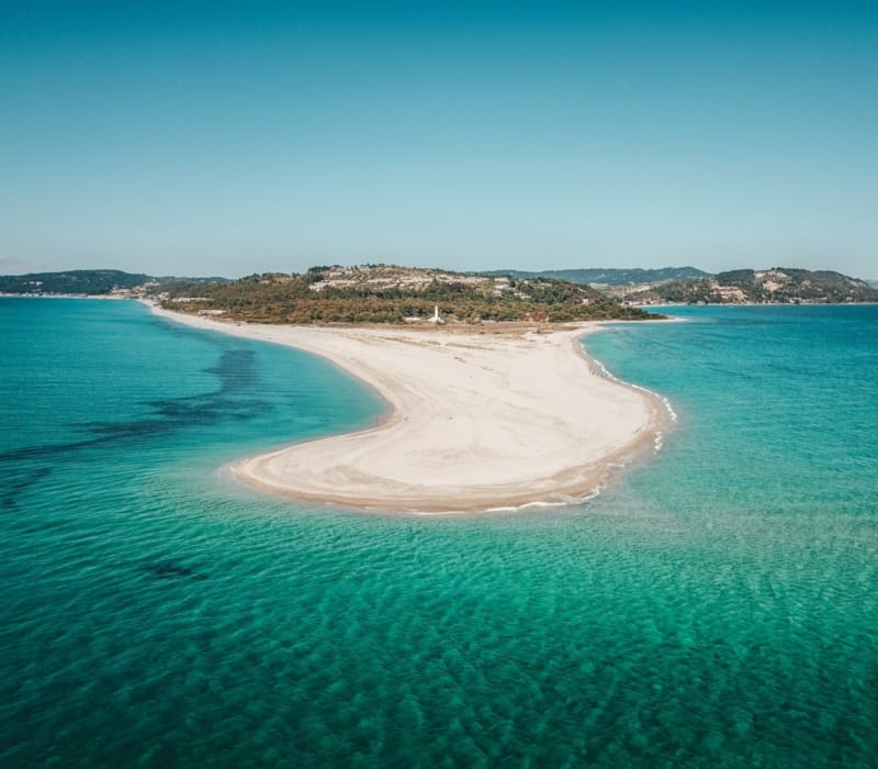 a beach with clear blue water