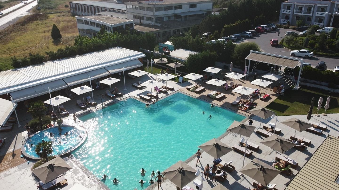 a pool with a building in the background