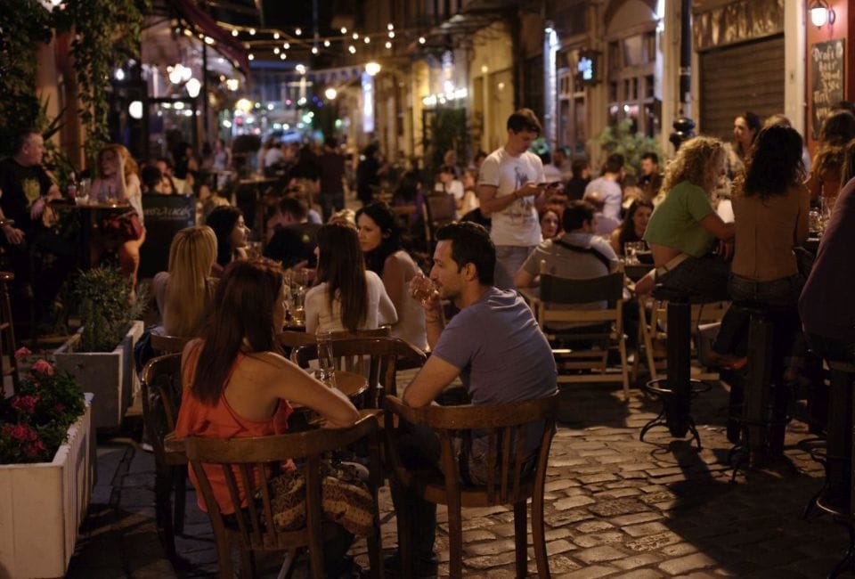 a group of people sitting at tables