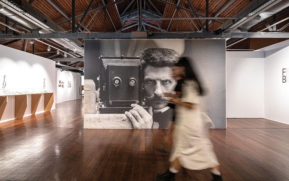 a man and a child in a room with a large black machine