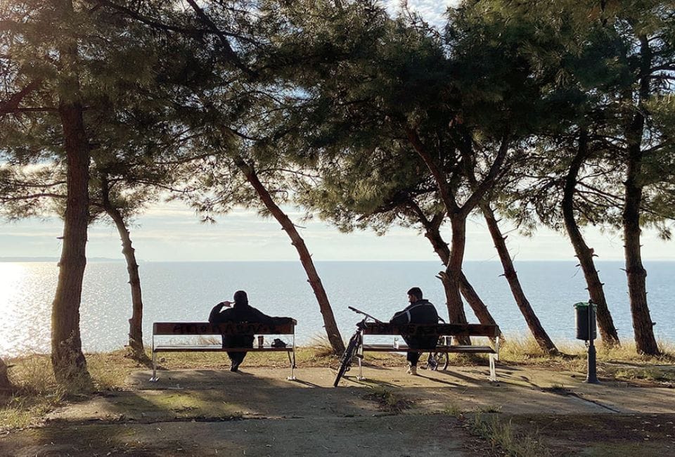 a couple sitting on a bench