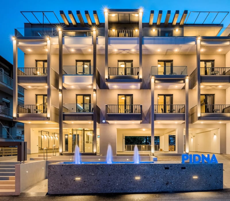 a building with a pool in front