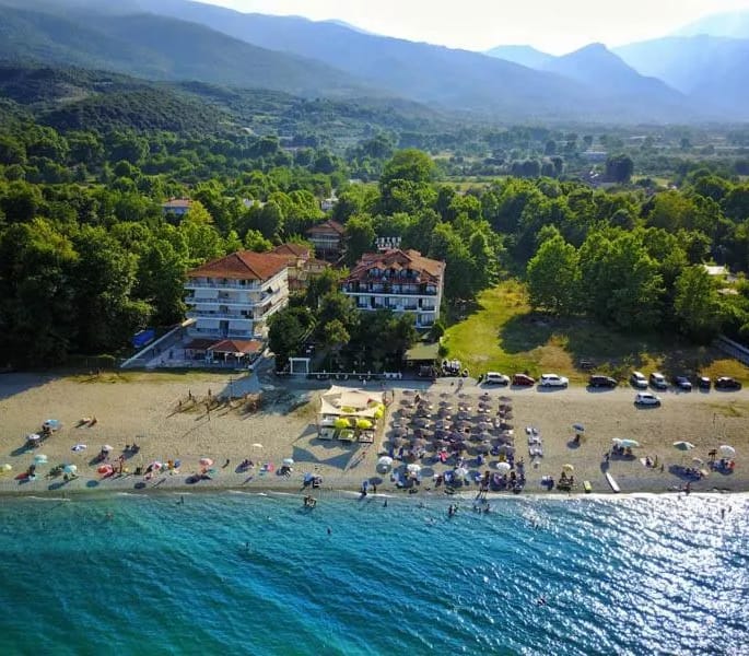 a beach with houses and trees