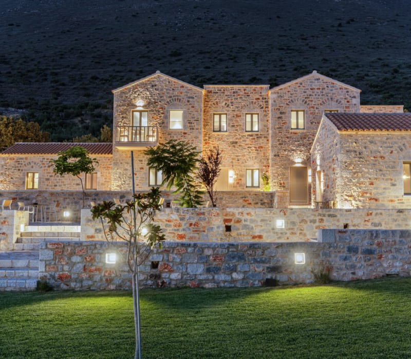 a large building with a grass lawn