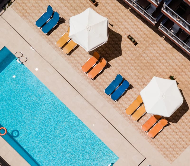 a pool with chairs around it