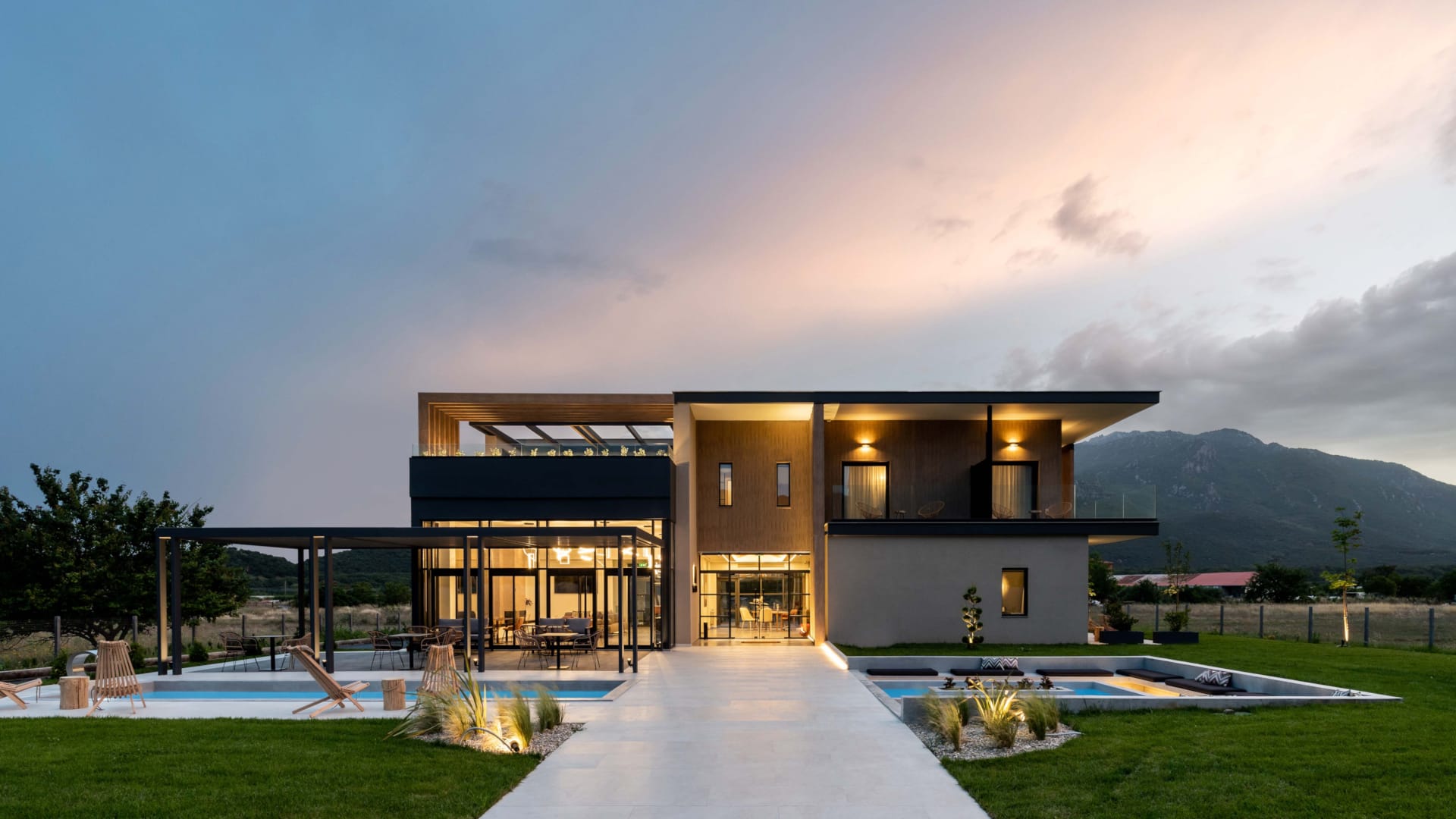 a house with a pool in front