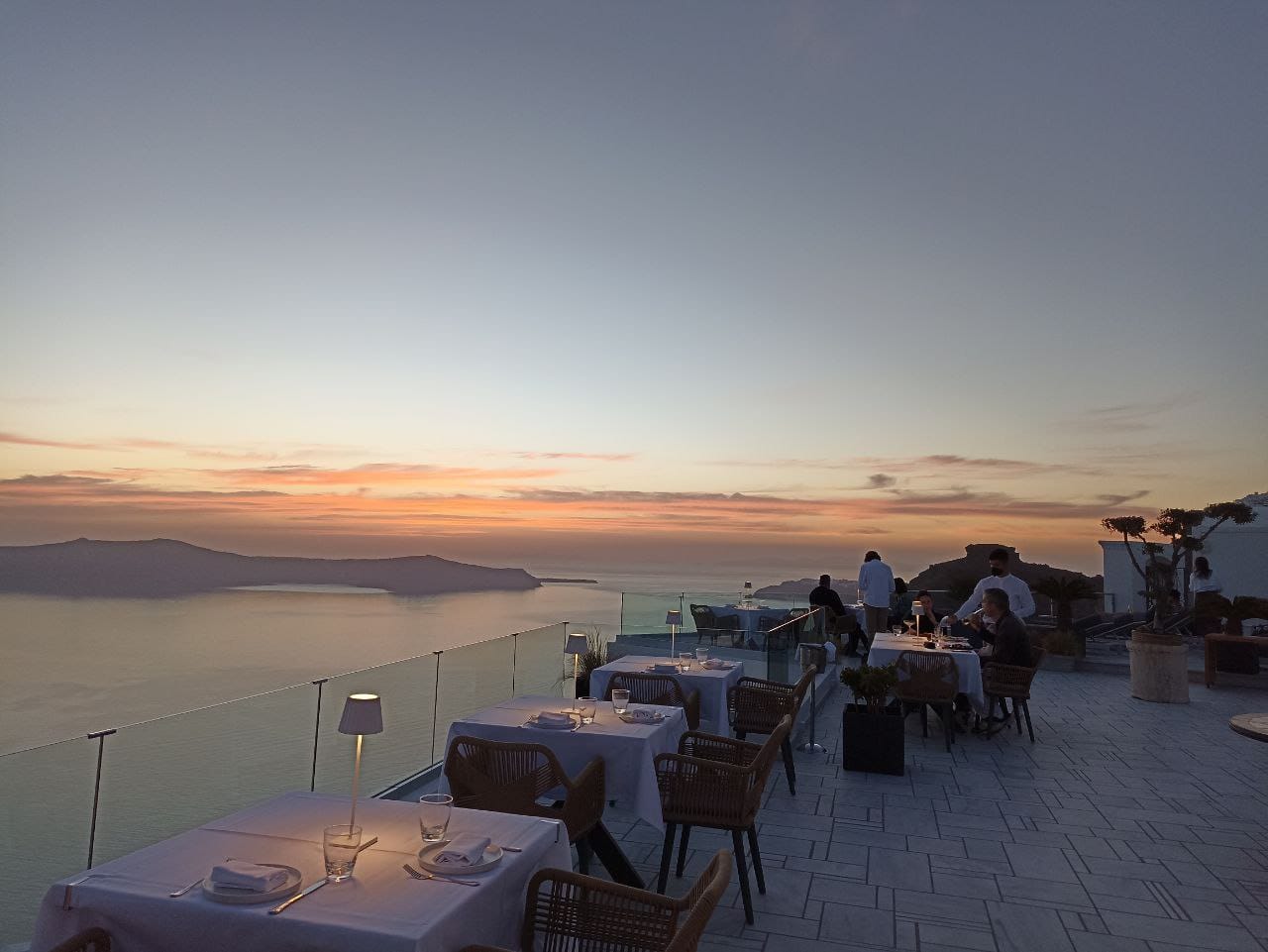 a beach with tables and chairs