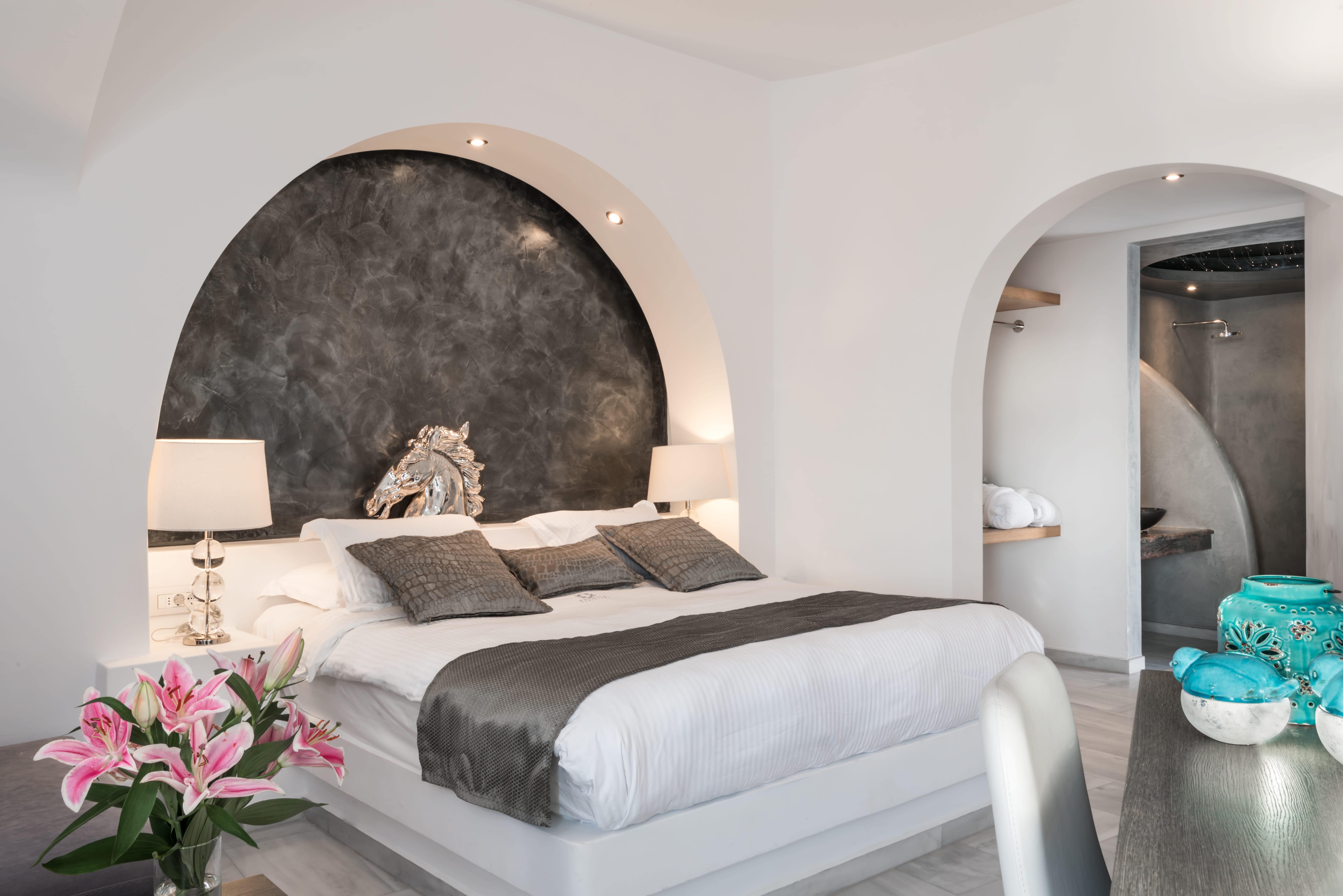 a bed with a large headboard