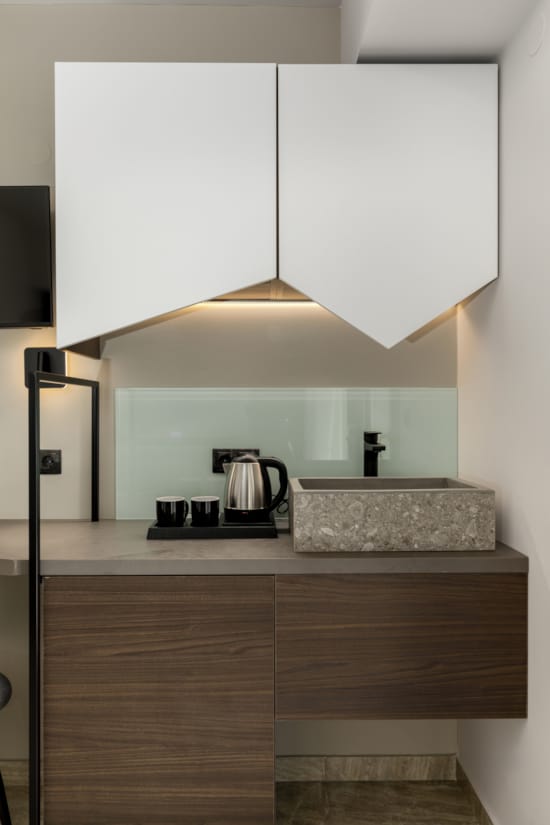 a kitchen with white cabinets