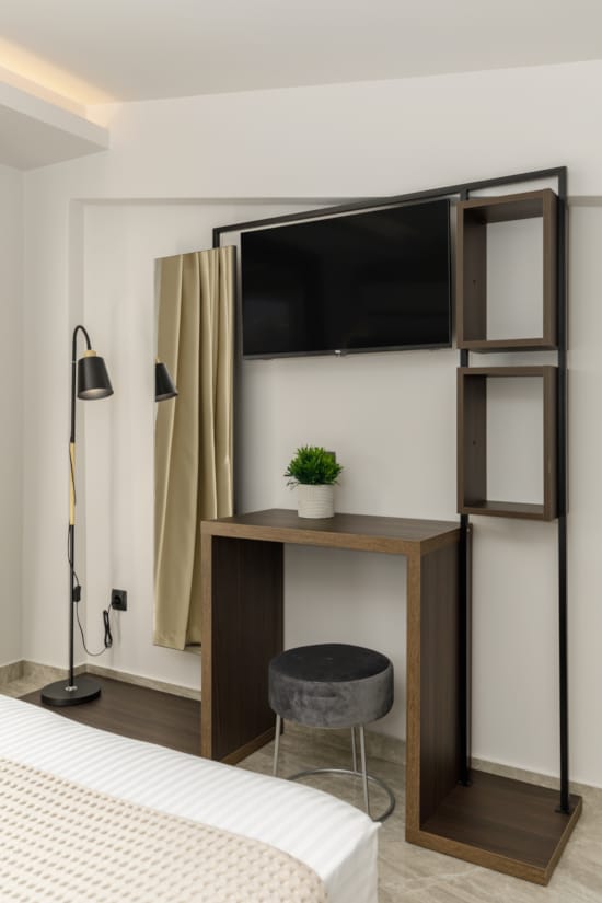 a room with a tv and a table