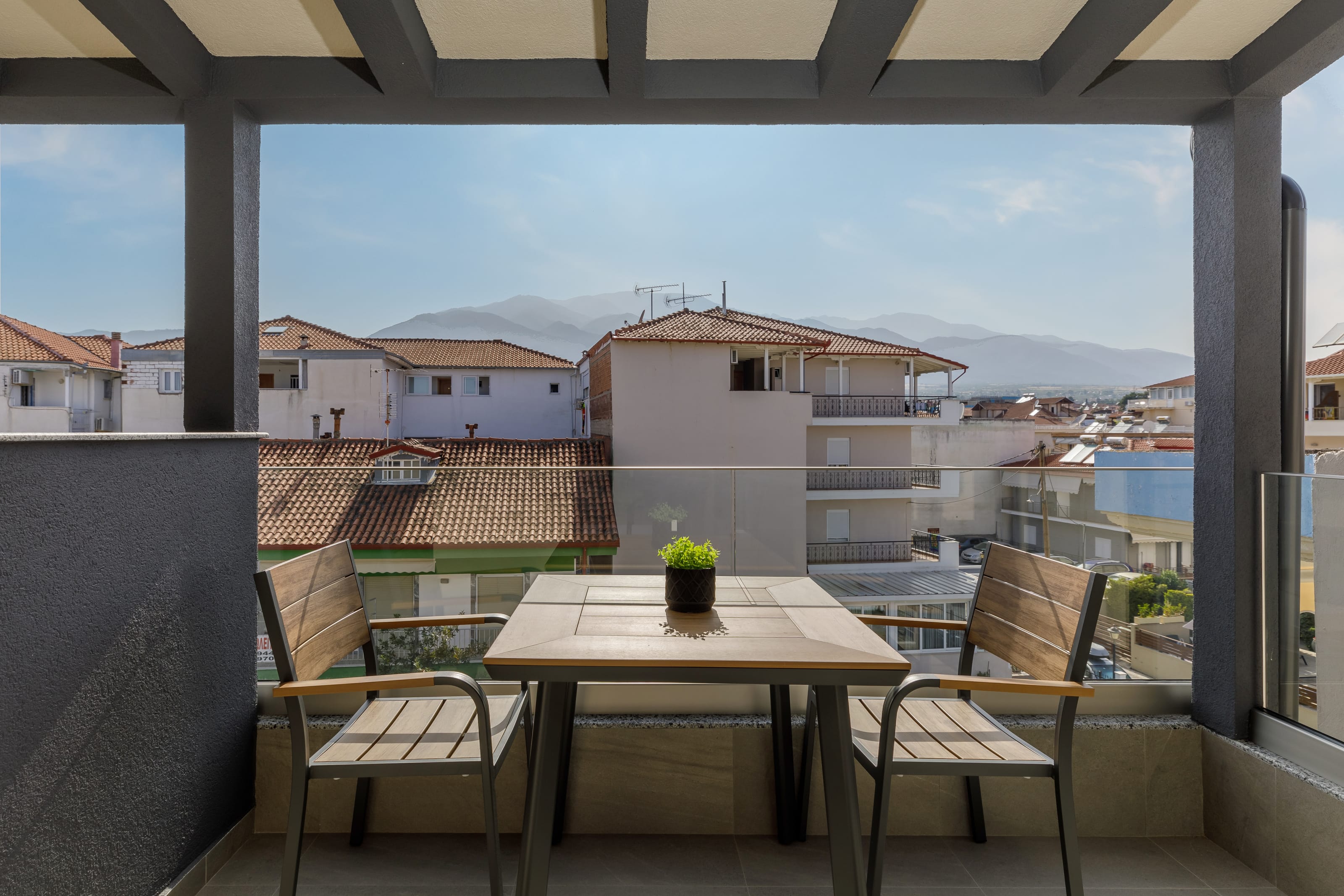 a table and chairs on a balcony