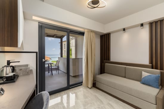 a living room with a glass door