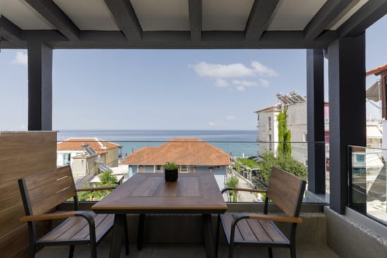 a table and chairs on a deck