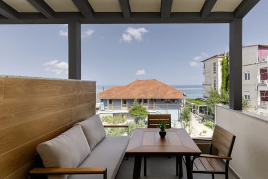 a table and chairs on a balcony